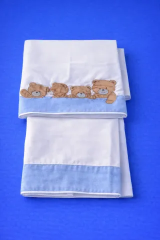 Ropa de cuna azul con tren