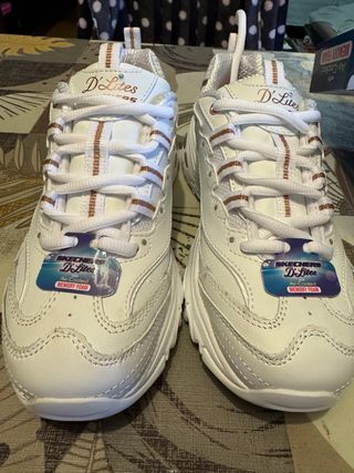 Zapatillas Skechers D'Lites Blancas y Doradas