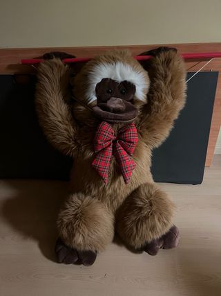 Tuta in peluche con fiocco a scacchi