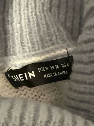 Jersey cuello alto rayas azul y blanco