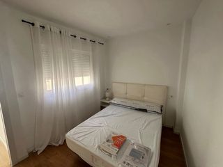 Ático con terraza ajardinada en el centro.