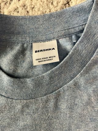 Camiseta azul clara con logo R.O:W.