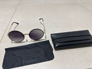 Gafas de sol redondas doradas y negras