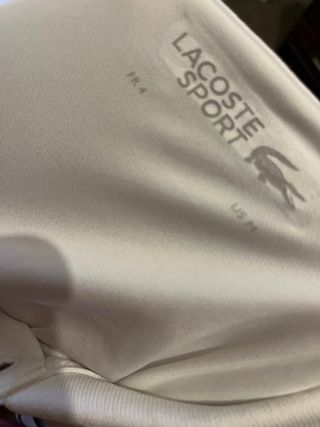 Polo Lacoste blanco y verde