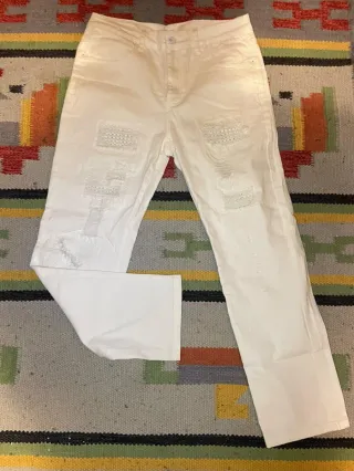 Jeans amiri bianchi strappati con pizzo