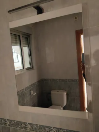 Espejo con lámpara de baño
