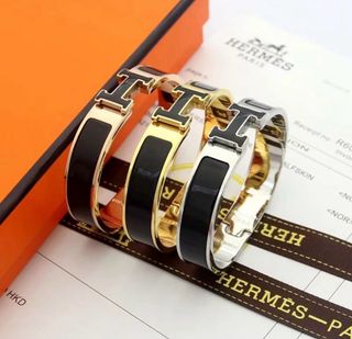 Pulsera Hermès H Negra y Dorada