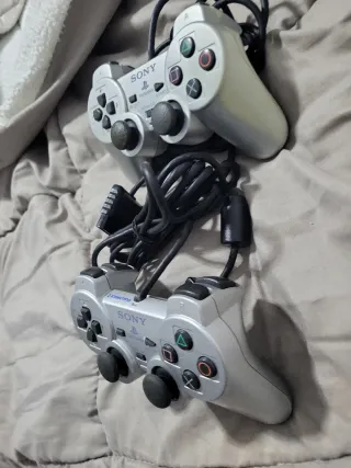2 Mandos PS2 Plateados (Sony) piezas o reparar