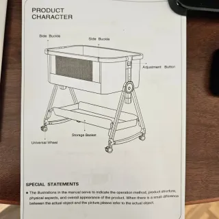 Cuna de bebé gris con cambiador