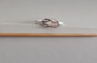 Anillo Nudo Infinito Plata ajustable.