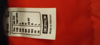 Piumino Quechua nero e arancione