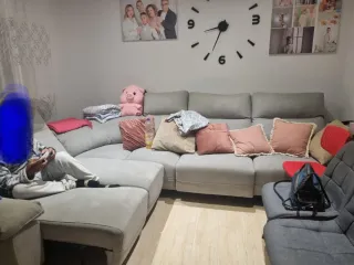 Sofá cama curvo gris