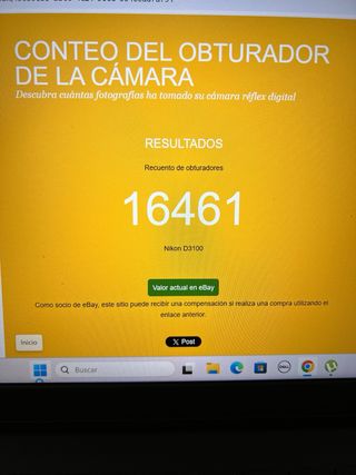 Cámara Nikon D3100 con objetivos y cargador