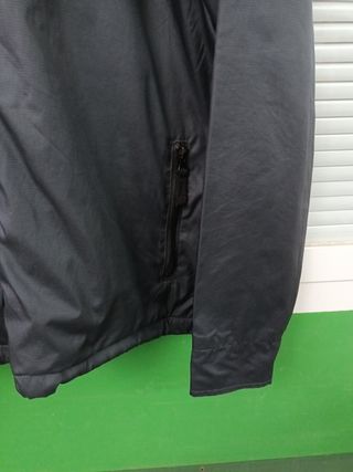 Chubasquero Xcel Surf.