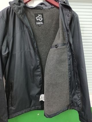 Chubasquero Xcel Surf.