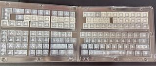 Tasti per tastiera grigi e bianchi