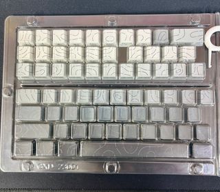 Tasti per tastiera grigi e bianchi