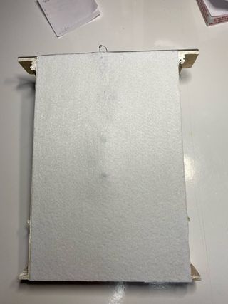 Angelo in ceramica con cornice dorata