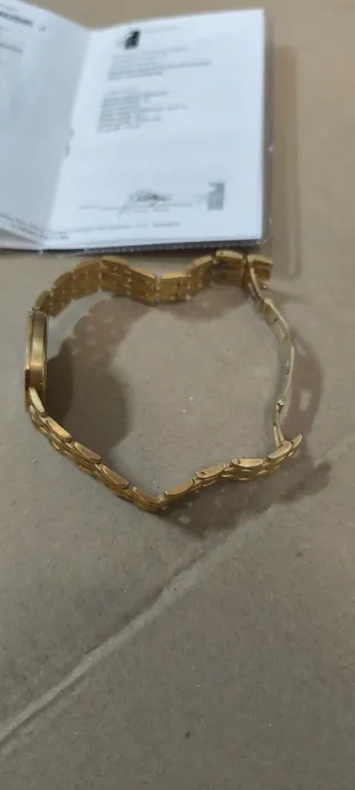 Reloj Titan Oro y Diamantes