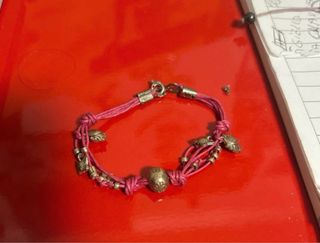 9 Braccialetto cordino  e 1 collana