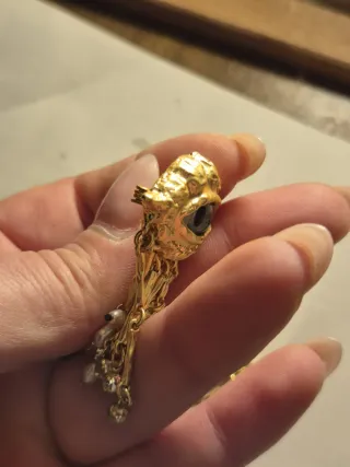 Spilla occhio dorato con perle e cristalli