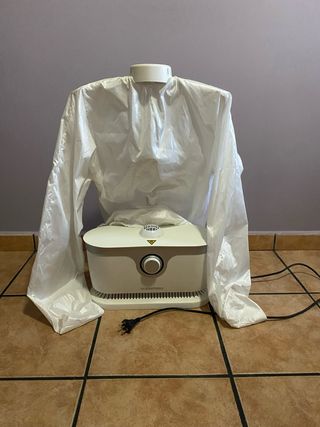 Plancha vapor ropa forma camiseta