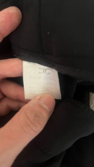 Pantaloni neri con borchie dorate