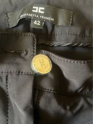 Pantaloni neri con borchie dorate