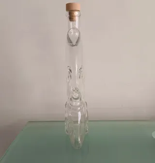 Bottiglia a forma di luna con volto