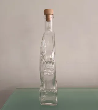 Bottiglia a forma di luna con volto