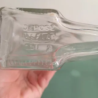 Bottiglia a forma di luna con volto