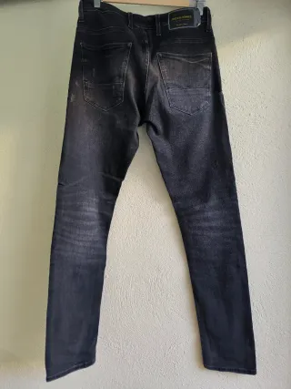 Vaqueros negros hombre desgastados