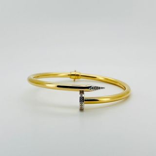 PULSERA RIGIDA CLAVO CON CIRCONITAS. Hueca. Oro 18