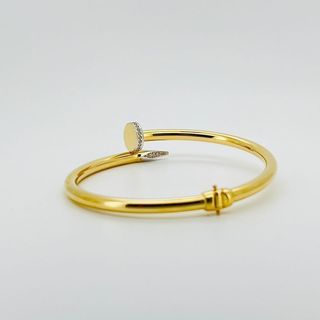 PULSERA RIGIDA CLAVO CON CIRCONITAS. Hueca. Oro 18