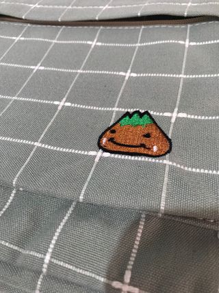 Mochila a cuadros gris sin estrenar