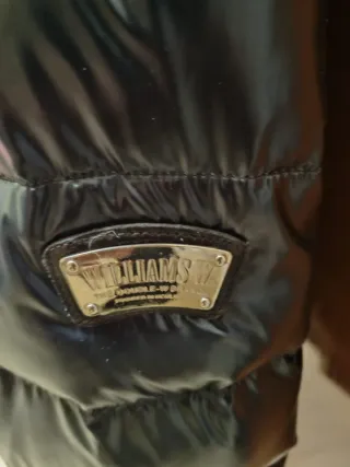 Piumino Wilson nero lucido con cappuccio