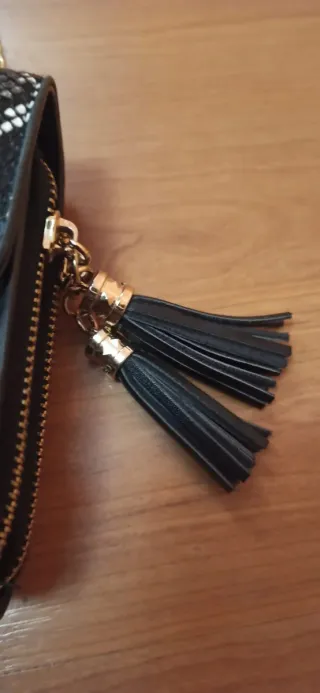 Bolso negro estampado serpiente