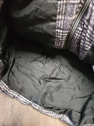 Plumífero gris y blanco. Milano