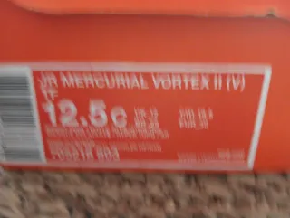 Scarpe da calcio Nike arancioni e argentate T.30.