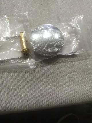 Tapón de bañera y pieza latón