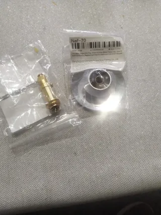 Tapón de bañera y pieza latón