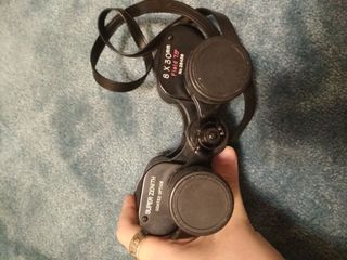 Prismáticos antiguos vintage con funda