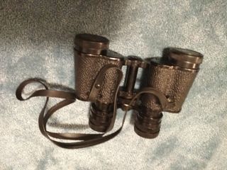 Prismáticos antiguos vintage con funda