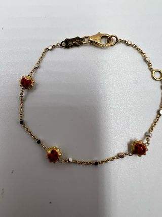 Pulsera de oro con mariquitas