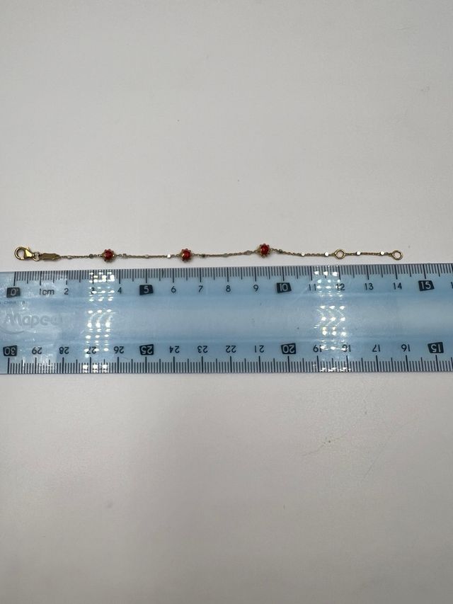 Pulsera de oro con mariquitas