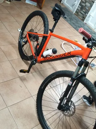 Bicicleta Rockrider naranja  Precio negociable