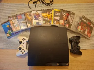 Ps3 Slim Negra con 2 mandos y 11 juegos