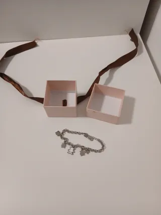 Pulsera de acero con charms