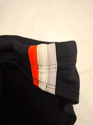 Slip mare uomo nero con dettagli arancioni