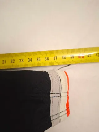 Slip mare uomo nero con dettagli arancioni